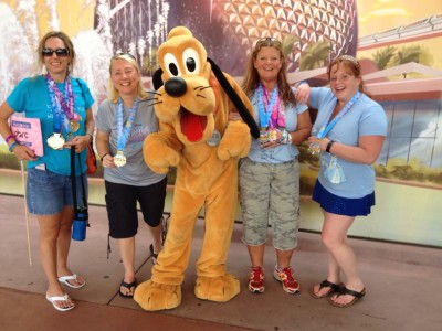 Cindy with Pluto and friends after runDisney's Princess Half Marathon